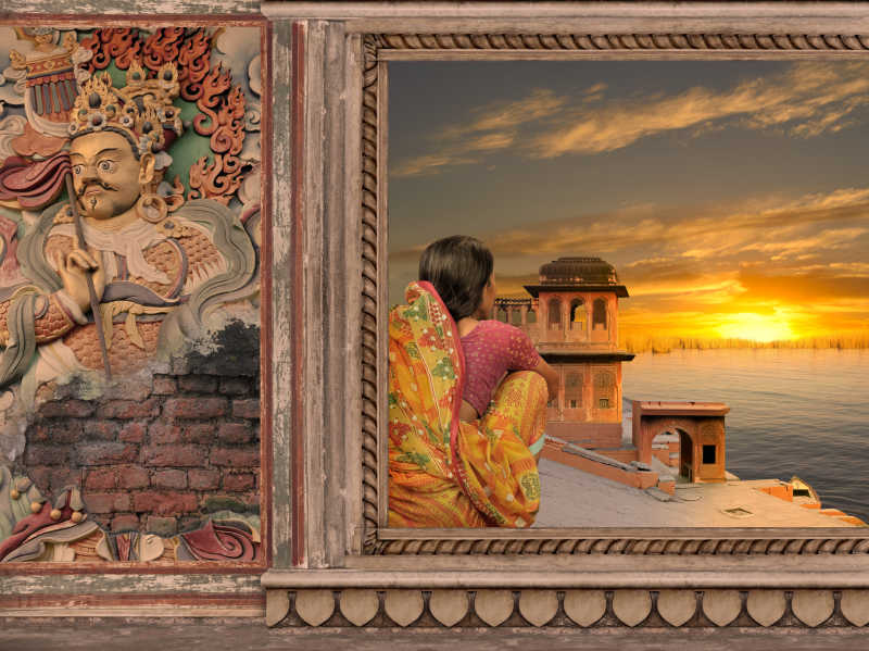 画框里的看着日出的印度女性