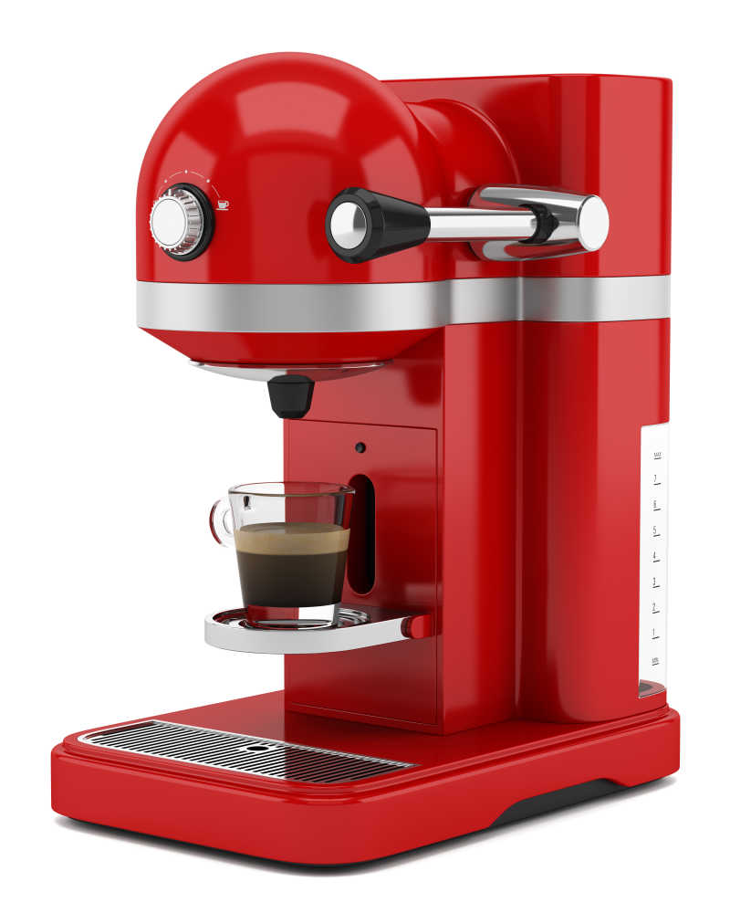 白色背景上的红色咖啡机特写
