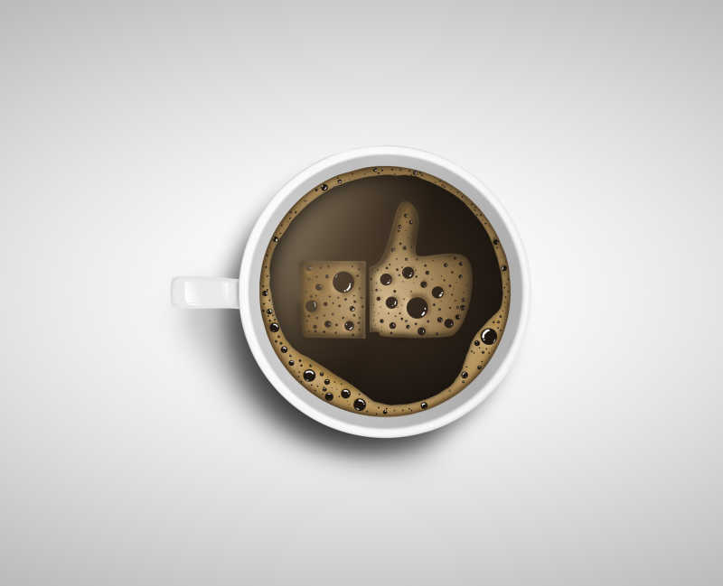 咖啡杯里的竖起大拇指状的咖啡沫
