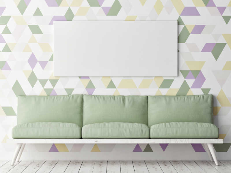 沙发和几何装饰背景墙上的模拟海报