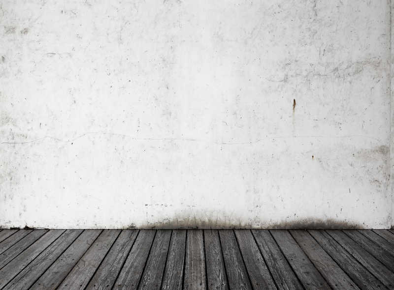 白色混凝土墙面和褐色木地板