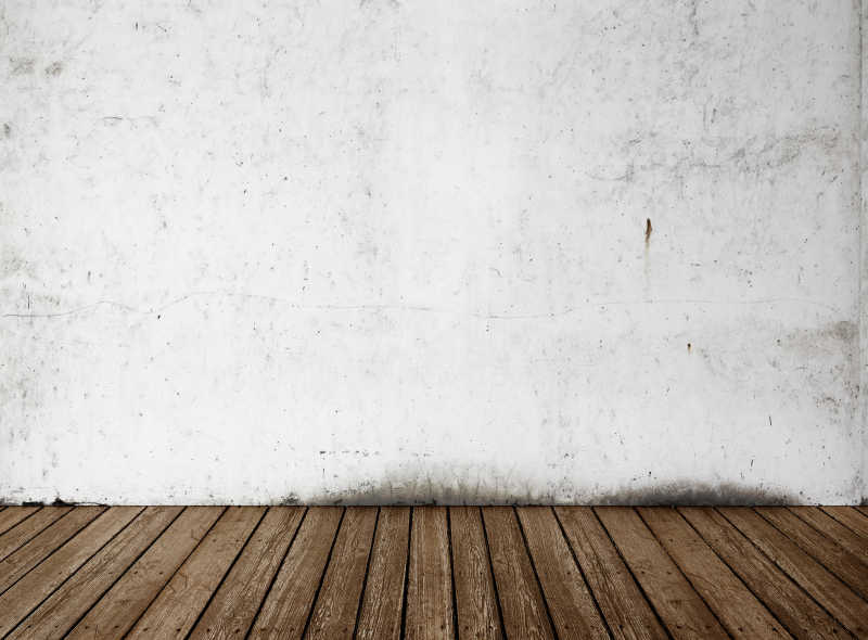 白色背景混凝土墙与咖啡色的木地板