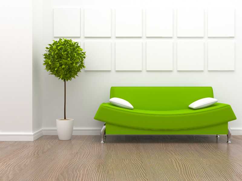 白色的室内有一个绿色的沙发
