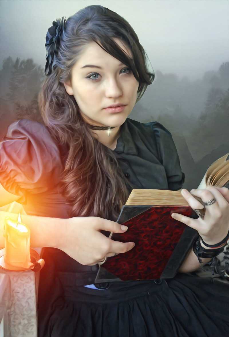 坐在蜡烛旁边看书的哥特风女孩