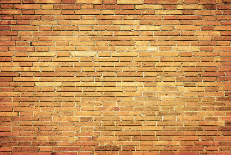 金色旧砖墙的背景
