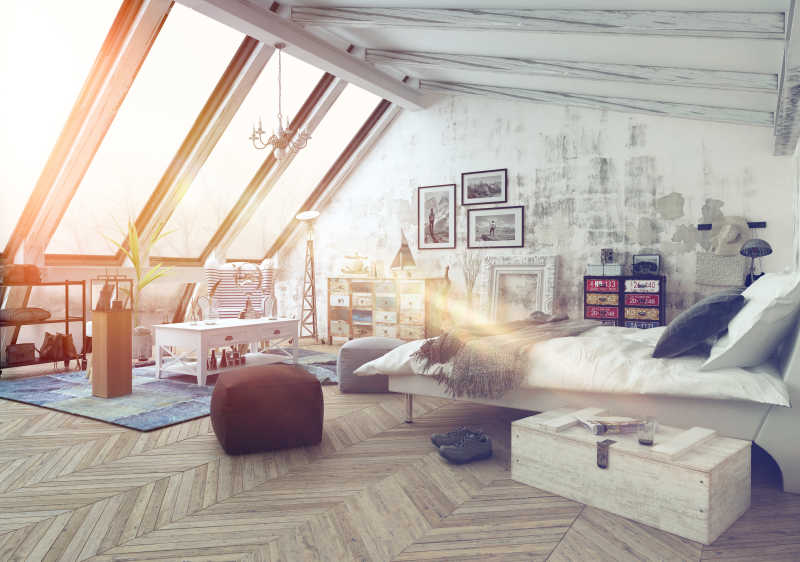阳光照射在现代简朴的铺着木地板的阁楼卧室