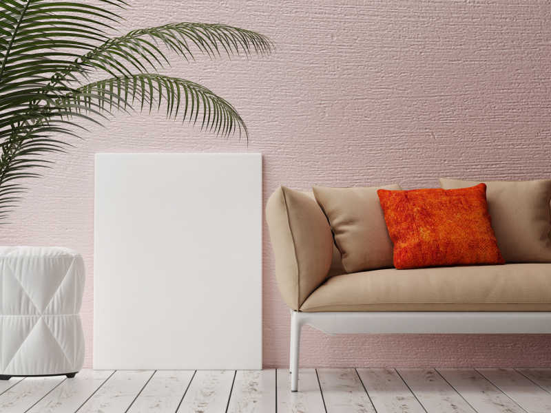 粉色可爱客厅沙发旁上的白色画布