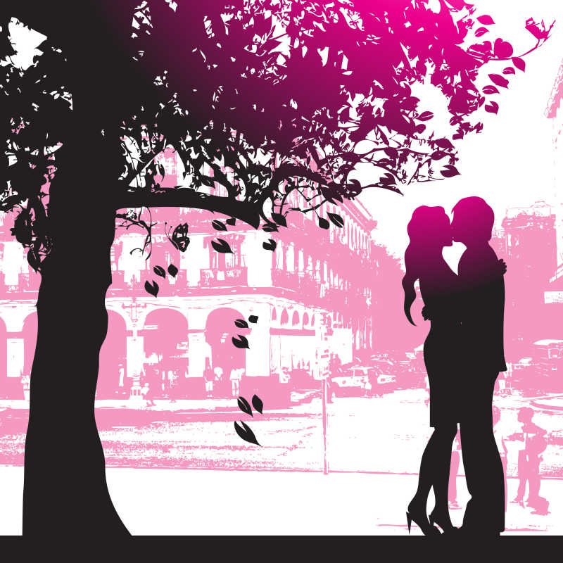 城市公园树下的情侣剪影