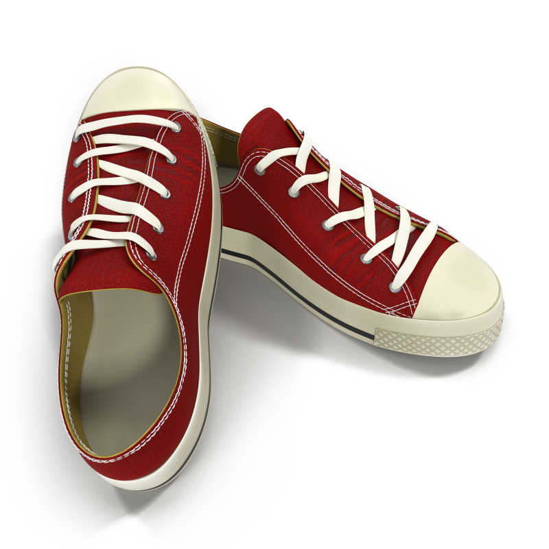 白色背景上的红色相叠的帆布鞋