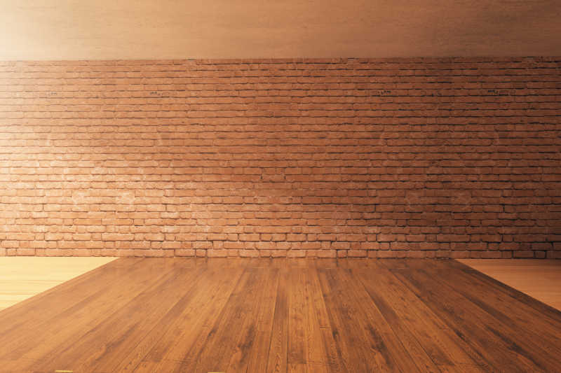空旷的房间里的红色砖墙和木地板