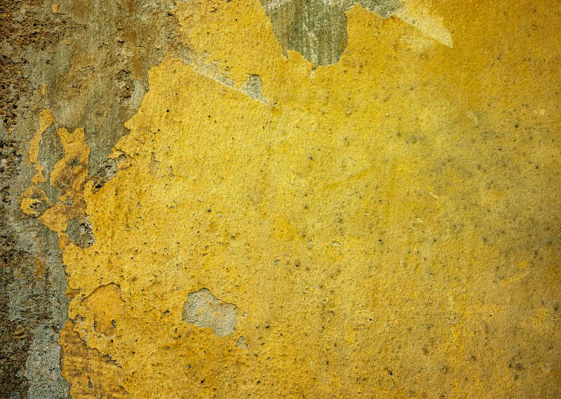 黄色破旧有墙体脱落的墙面纹理背景