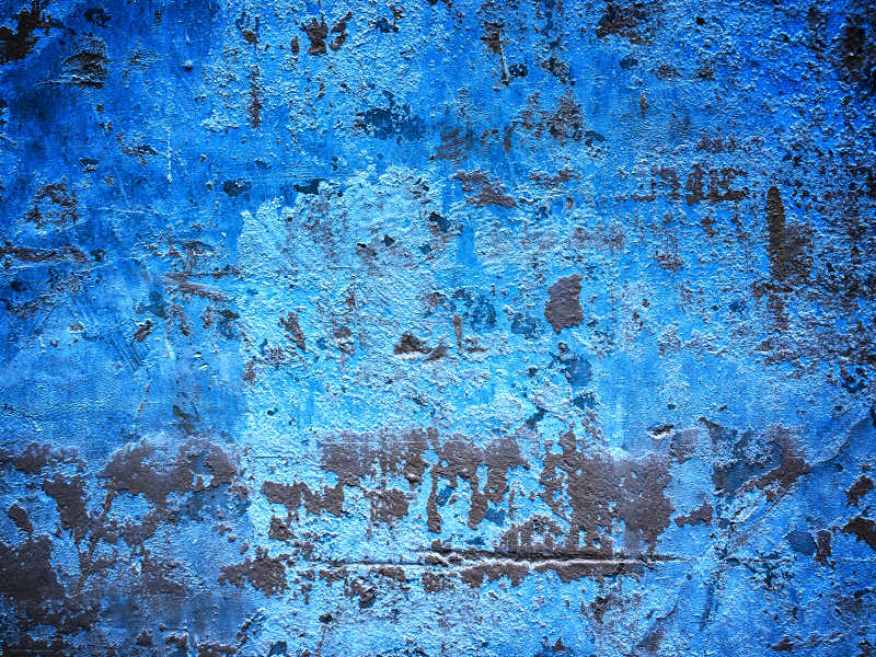 脏裂的蓝色墙壁纹理背景