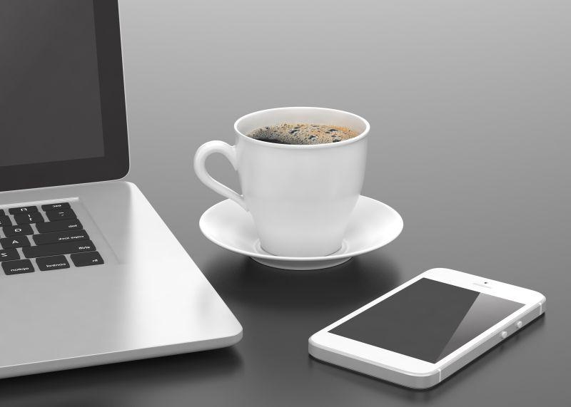 笔记本电脑和智能手机和咖啡杯