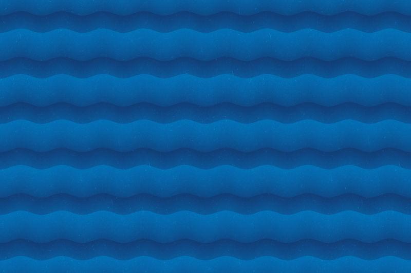 蓝色背景上的波浪痕迹纹理