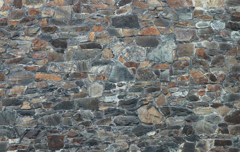 石砌不均的旧石墙背景