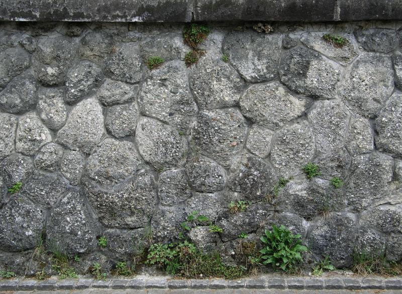 地道桥路边石墙背景