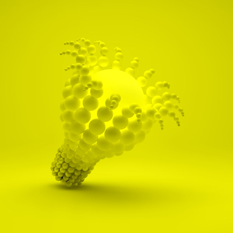 矢量黄色球体包围的灯泡设计