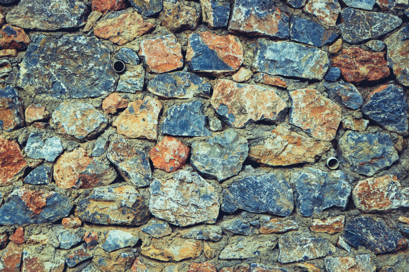 粗糙的石头背景石砌鹅卵石墙面