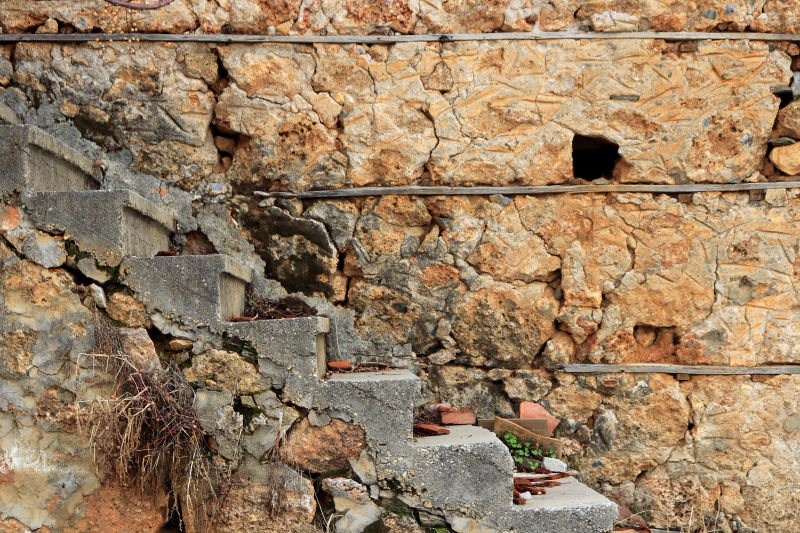 贝壳石砌成的房子鹅卵石铺成阶梯状的墙壁coquina表面背景