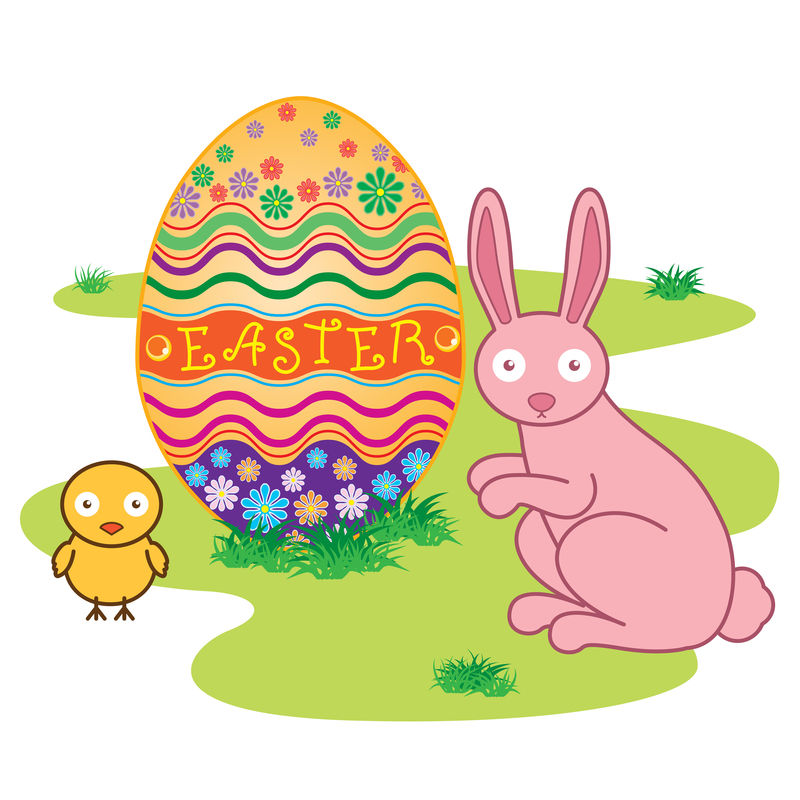 复活节兔子-在新鲜的绿草上装饰复活节彩蛋