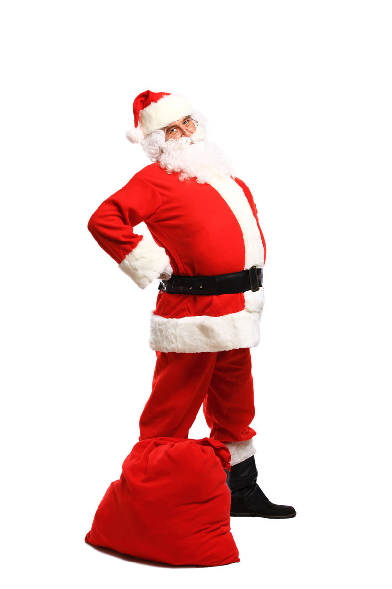 一张圣诞老人在袋子旁边摆姿势的全幅画像