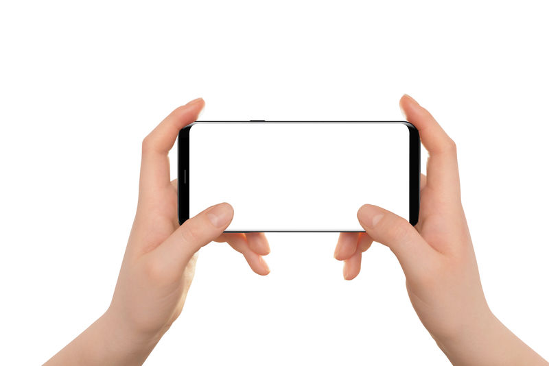 女性手把现代的黑色手机放在水平位置白色背景的独立手和智能手机