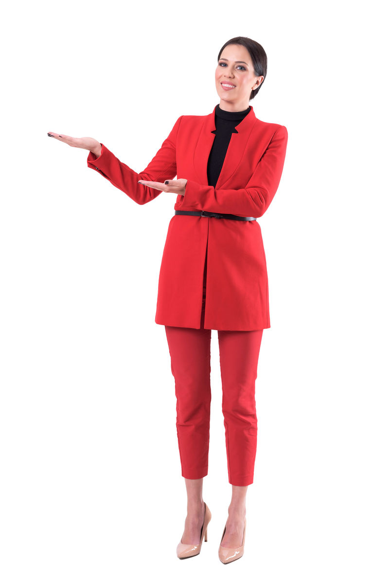 微笑友好优雅的女士穿着红色西装广告复印空间全身隔离在白色背景上