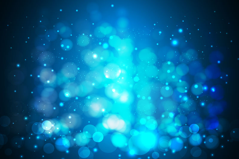 闪光抽象波克蓝颜色圣诞灯模糊在黑色背景上