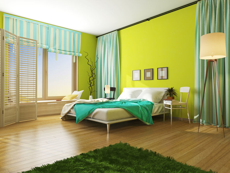 室内卧室有一条毯子和绿松石色的窗帘。