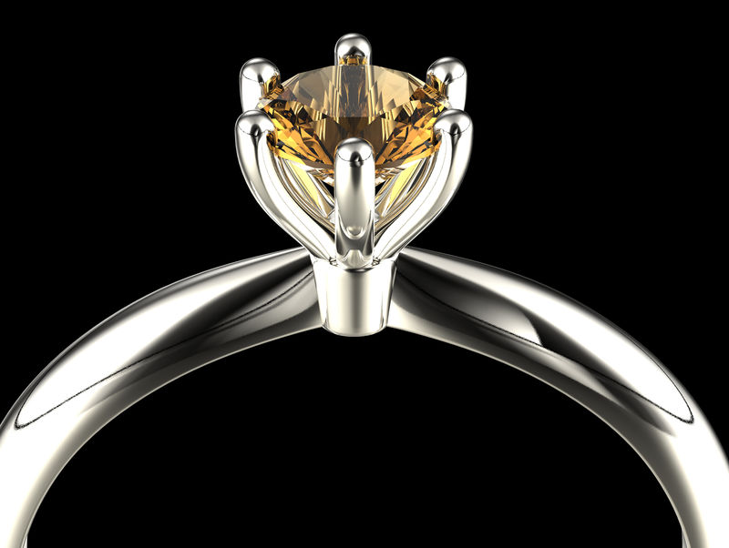 镶有钻石或莫桑石的订婚戒指珠宝背景