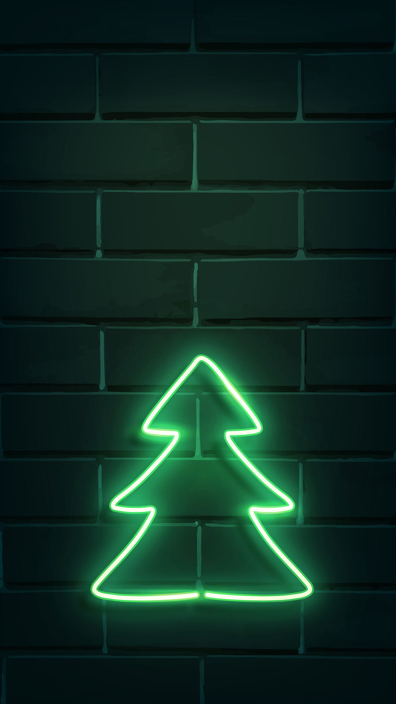黑色砖墙上的圣诞树霓虹灯标牌