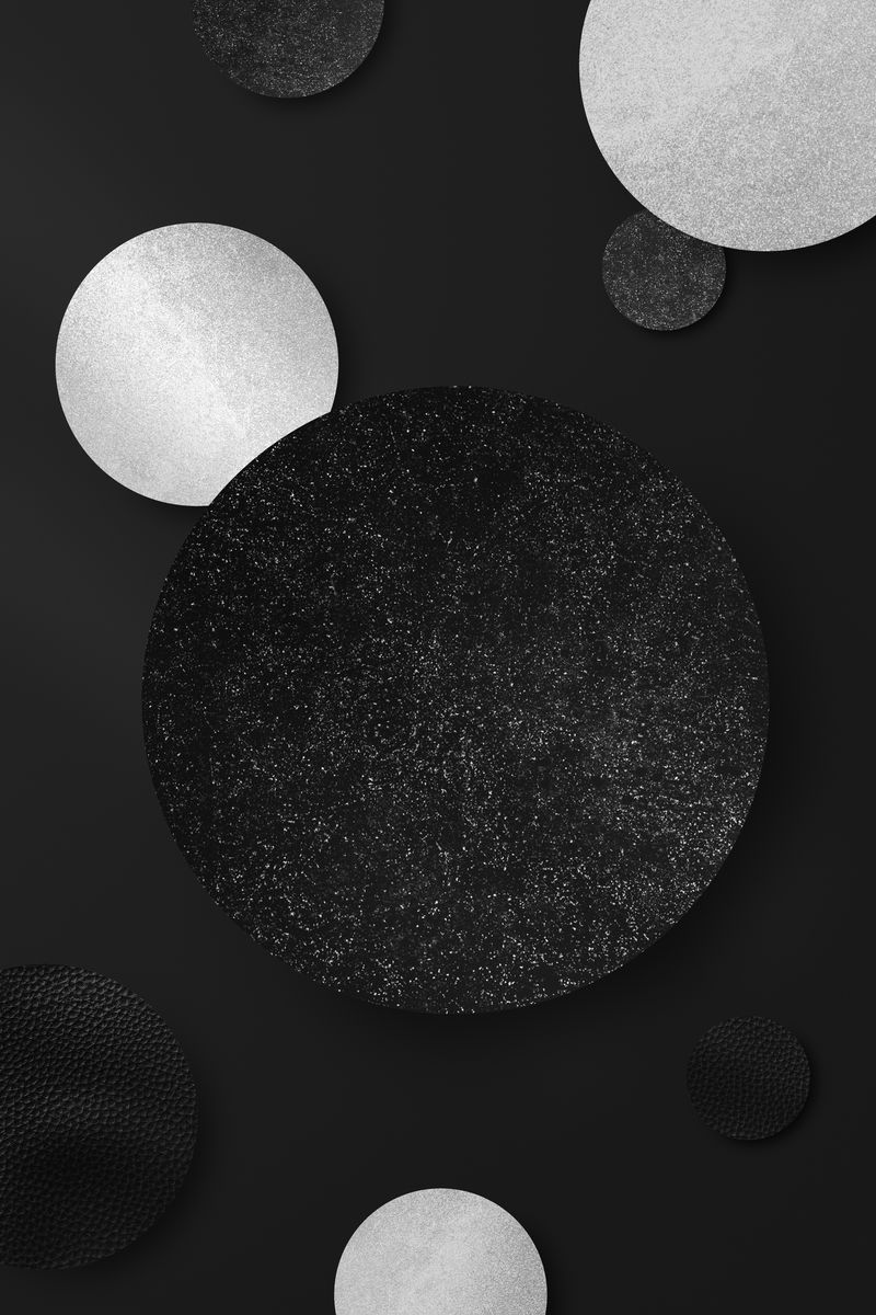 闪亮的黑色和银色圆形图案背景矢量