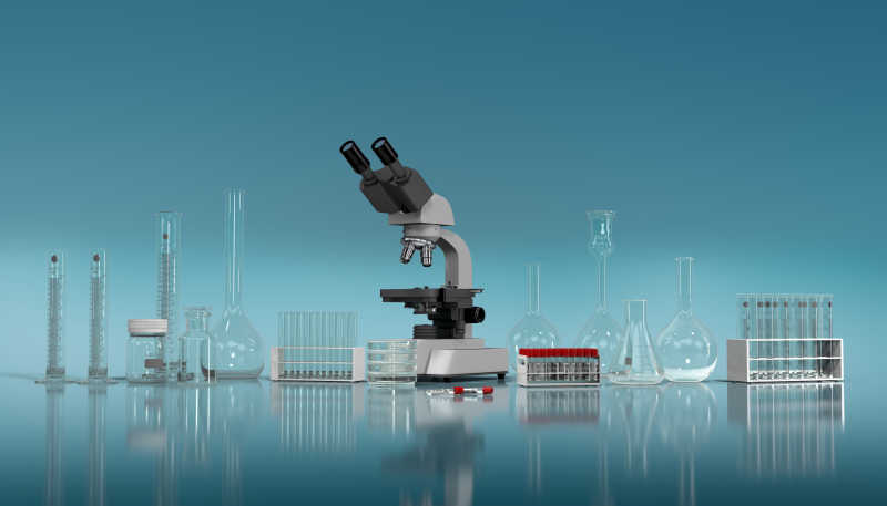 蓝色背景上的显微镜和实验玻璃器皿